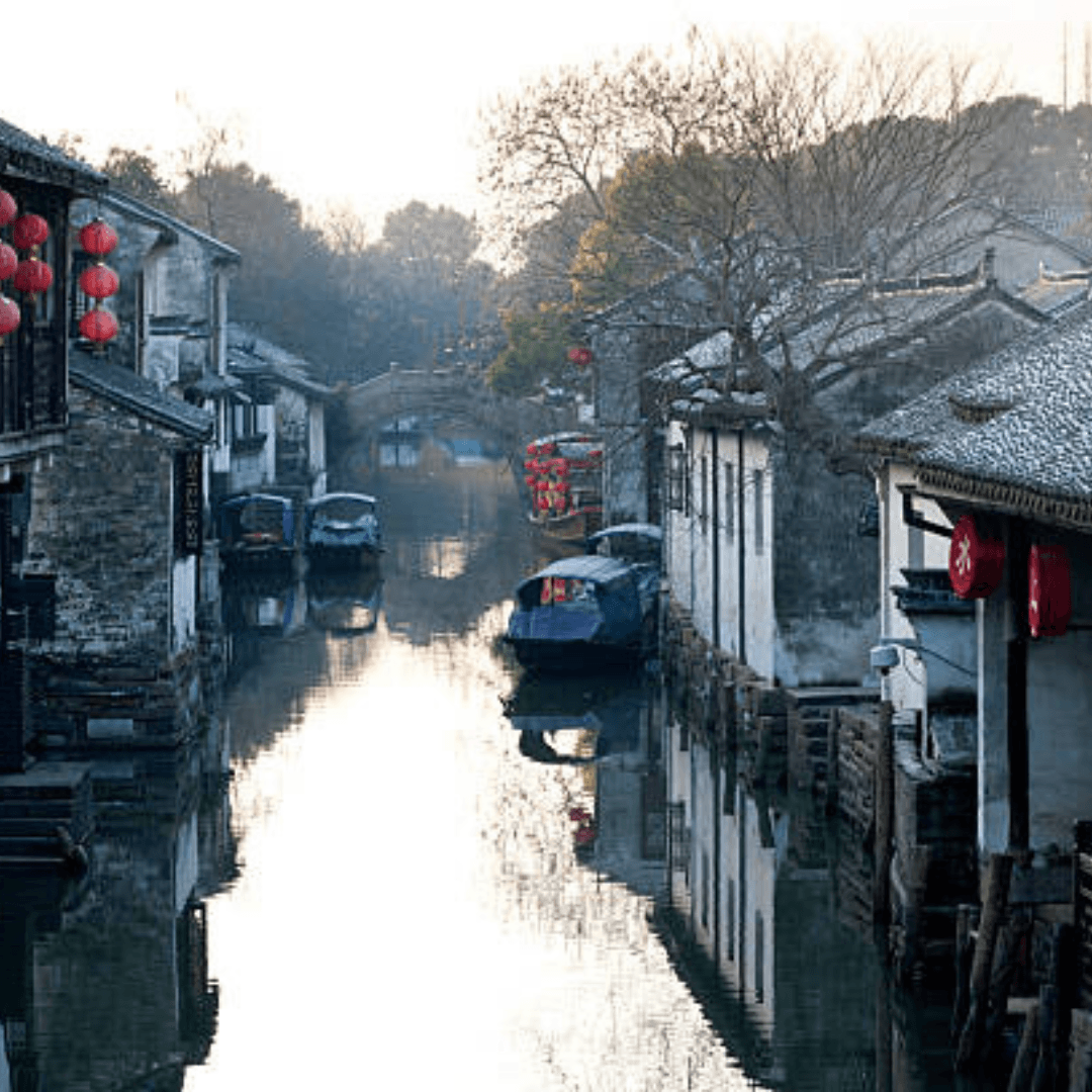 Zhujiajiao is a charming ancient water town near Shanghai, known for its stone bridges, narrow canals, traditional houses, and rich history dating back over 1,700 years, offering a peaceful glimpse into old-world China.