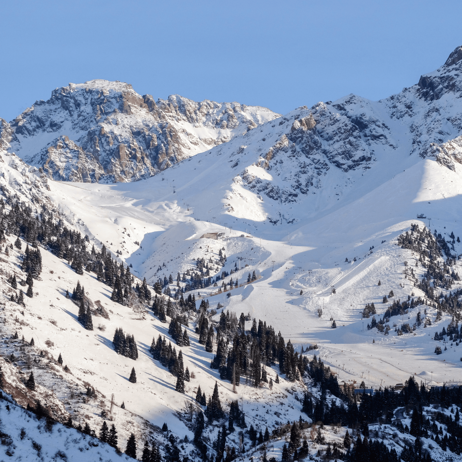 Shymbulak Ski Resort: Enjoy a thrilling gondola ride to the top of this world-class ski resort, offering breathtaking views of the Zailiyskiy Alatau mountains. Whether you want to ski, snowboard, or simply soak in the scenery, the resort provides a perfect winter wonderland experience. The area is dotted with cozy cafes, making it ideal for relaxation. In summer, hiking trails replace the snow-covered slopes, offering a completely different adventure.