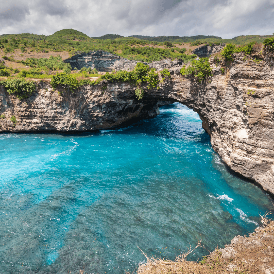 Embark on a journey to Nusa Penida Island, where you can witness the unspoiled beauty of Kelingking Beach. Known for its dramatic coastal cliffs shaped like a Tyrannosaurus Rex, this spot is perfect for photography and scenic walks.