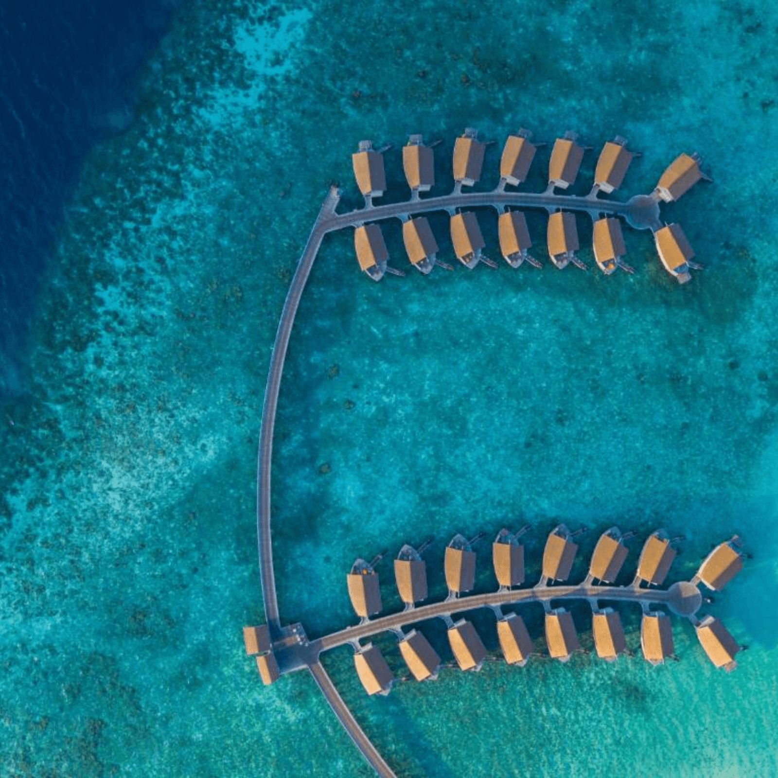 Stay in a luxurious overwater villa with incredible views of the ocean.