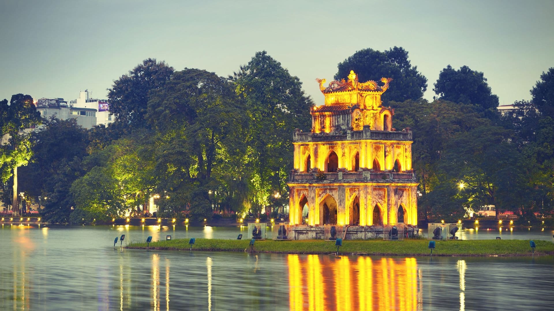 Enjoy a cyclo ride through Hanoi’s Old Quarter, savor local street food stalls, and end the day with a traditional water puppet show for an authentic cultural experience.